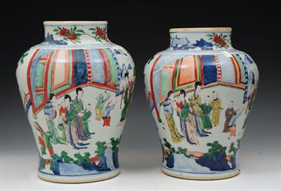 Lot 521 - TWO CHINESE WUCAI DECORATED JARS of inverted baluster form decorated with a  gathering of ladies and