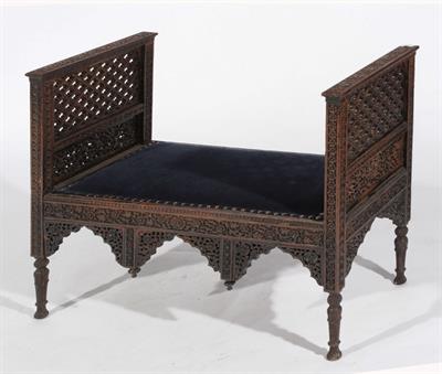 Lot 553 - A KASHMIRI CARVED WINDOW SEAT with open fretwork sides