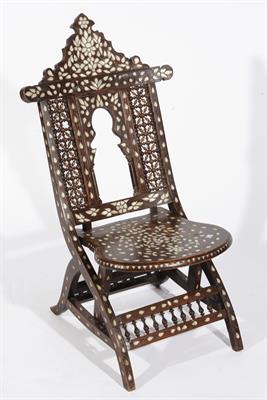 Lot 555 - A SYRIAN INLAID LOW FOLDING CHAIR with inlaid mother-of-pearl leaf designs