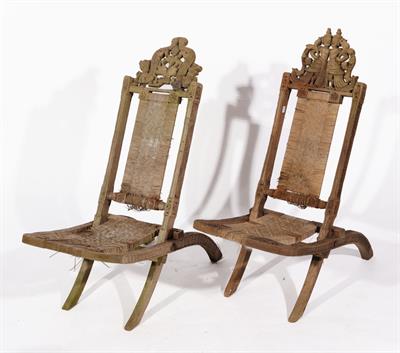 Lot 558 - TWO SIMILAR CARVED BURMESE FOLDING CHAIRS