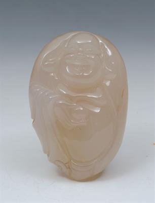 Lot 575 - A CHINESE OVAL CARVED WHITE JADE BUDDHA