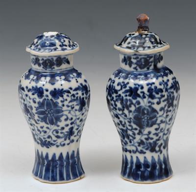 Lot 576 - A PAIR OF MINIATURE CHINESE BLUE AND WHITE PORCELAIN VASES and covers