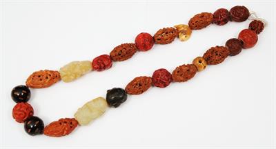 Lot 615 - A CHINESE CARVED NUT AND JADE SET NECKLACE