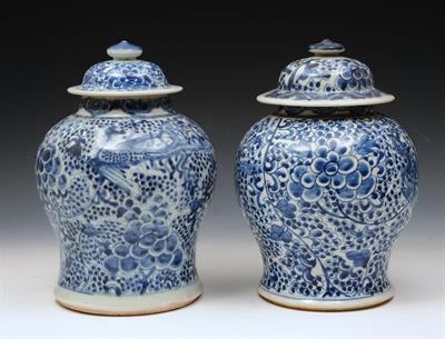 Lot 620 - A PAIR OF CHINESE BLUE AND WHITE BALUSTER VASES and covers with dragon designs