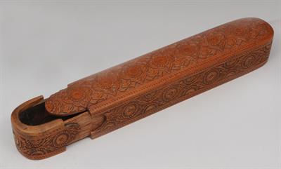 Lot 679 - AN INDO-PERSIAN BOXWOOD CARVED QALAMDAN with stylised lotus designs to the lid