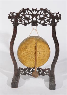 Lot 684 - A CHINESE HARDWOOD FRAMED GONG with prunus decoration