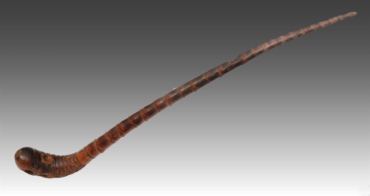 Lot 697 - A THAILAND BAMBOO OPIUM PIPE of tapering form with metal inset mounts