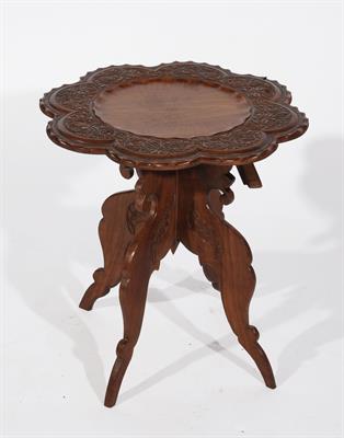 Lot 706 - A BURMESE CARVED OCCASIONAL TABLE with lotus leaf top