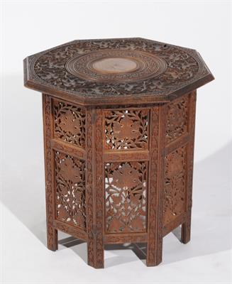 Lot 707 - AN INDIAN CARVED OCTAGONAL OCCASIONAL TABLE with allover leaf designs