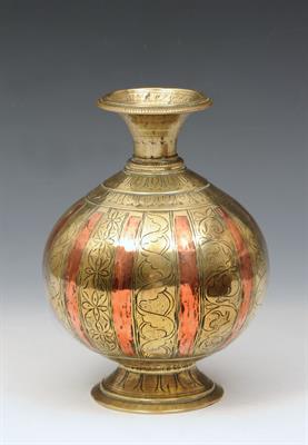 Lot 713 - AN INDIAN MUGHAL ENGRAVED BRASS WATER VESSEL of baluster form with inlaid copper bands