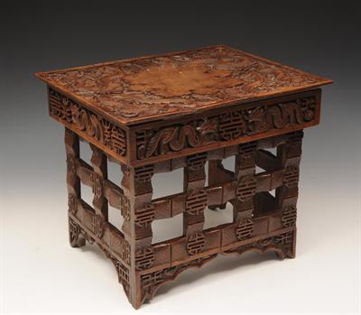 Lot 736 - A CHINESE CARVED FOLDING ARTIST'S TABLE with dragons to each corner