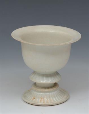 Lot 741 - A CHINESE WHITE GLAZE PEDESTAL CUP with reeded upturned circular foot