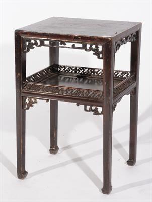 Lot 743 - A CHINESE STAINED ELM STAND of two tiers with fretwork borders