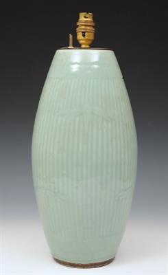 Lot 745 - A CHINESE CELADON PORCELAIN VASE of reeded form with bamboo leaf designs converted to a lamp