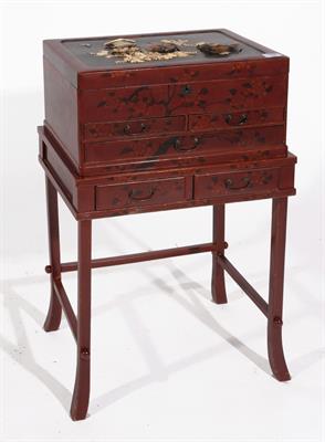 Lot 750 - A JAPANESE LACQUER CASKET on a low stand