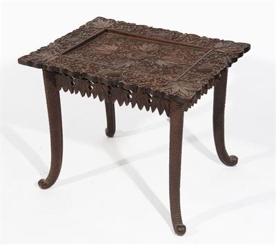 Lot 752 - A BURMESE CARVED RECTANGULAR OCCASIONAL TABLE with allover leaf and stylised bird designs