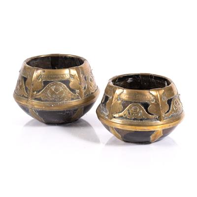 Lot 235 - Two coconut and brass grain measures