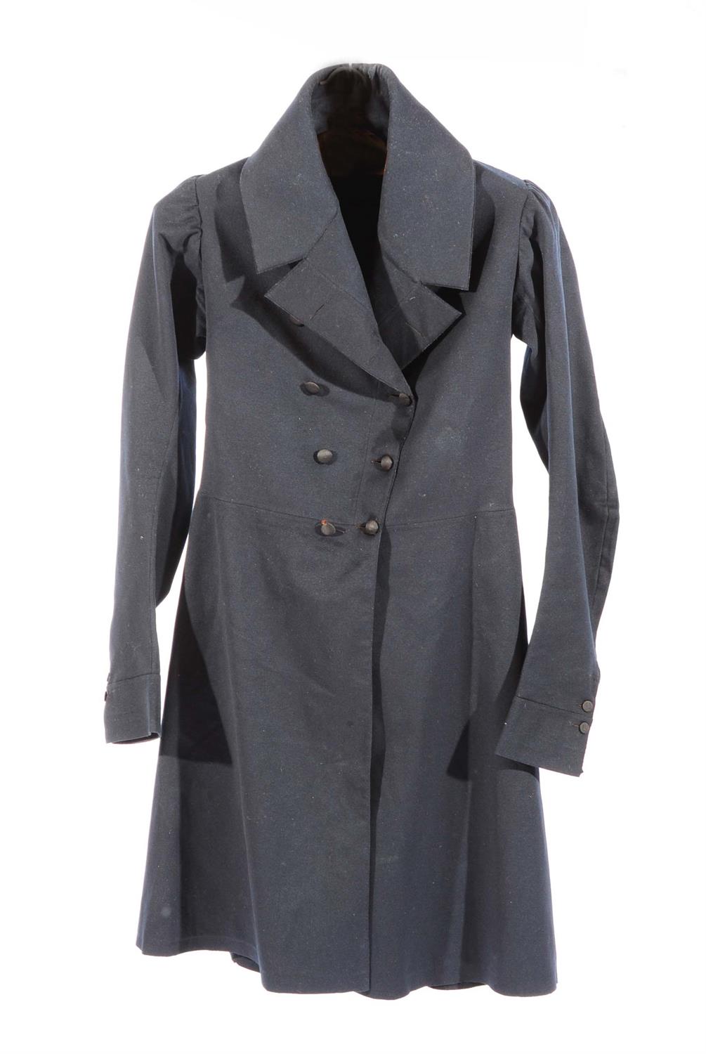 Lot 184 - A LATE 19TH CENTURY BOY'S BLACK FROCK COAT with wide lapels and silk lined