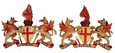 Lot 197 - A PAIR OF CARVED AND PAINTED PINE CARTOUCHES representing the Arms of the City of London and bearing
