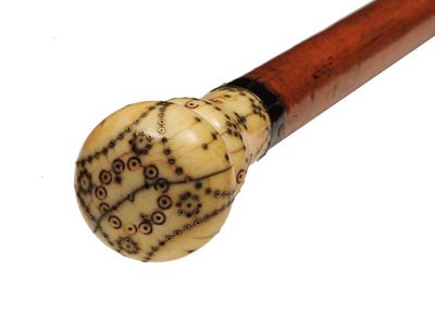 Lot 224 - AN 18TH CENTURY IVORY AND PIQUÉ WORK DANDY CANE