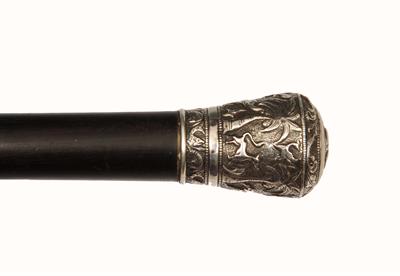 Lot 225 - AN INDIAN WHITE METAL TOPPED WALKING CANE