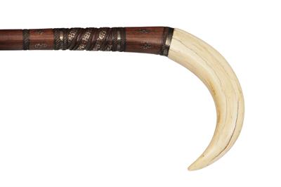 Lot 239 - AN UNUSUAL BOAR'S TOOTH HANDLED WALKING CANE