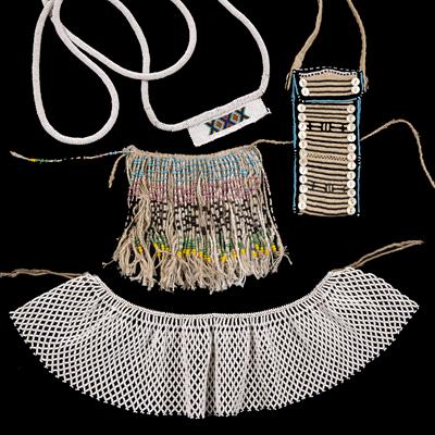 Lot 266 - A XHOSA YOUNG GIRL'S BAG with beaded and mother of pearl decoration; a Zulu dance harness; a beaded