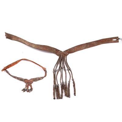 Lot 273 - A HERERO MOTCHIRA BOY'S REAR APRON with metal beads; and another similar (2)