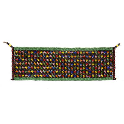 Lot 274 - A MSINGA WOMAN'S APRON with sinew and multi-coloured flower decoration