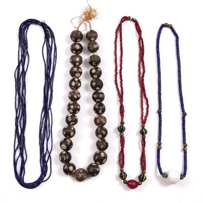 Lot 281 - A NDEBELE PAINTED CLAY IMITATION MURANO NECKLACE; a 'Dogan' bead necklace; a red/green trade bead