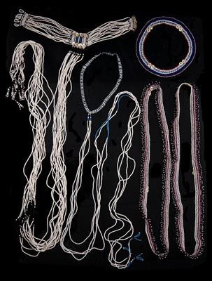 Lot 287 - A FINGO PAIR OF MEN'S BANDOLIERS; a Fingo man's sinew headband; and two Xhosa 'Cascade' necklaces