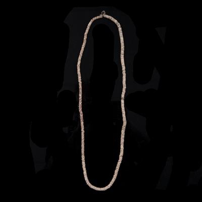 Lot 289 - AN OVAMBO CONUS SHELL PENDANT on ostrich shell necklace