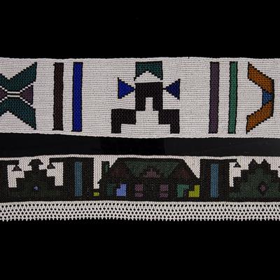Lot 296 - A NDEBELE LONG BEADED STRIP decorated with stylised dwellings