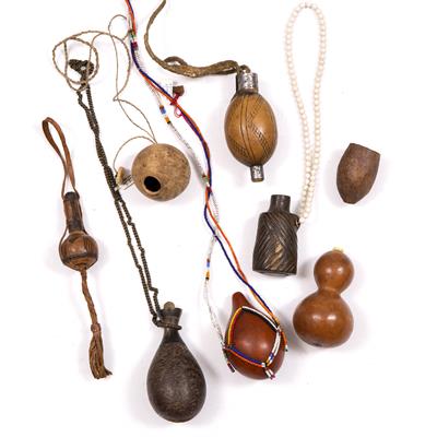 Lot 305 - A MASAI SNUFF GOURD with multi-coloured beaded string; a Shangaan snuff gourd; and six others (8)