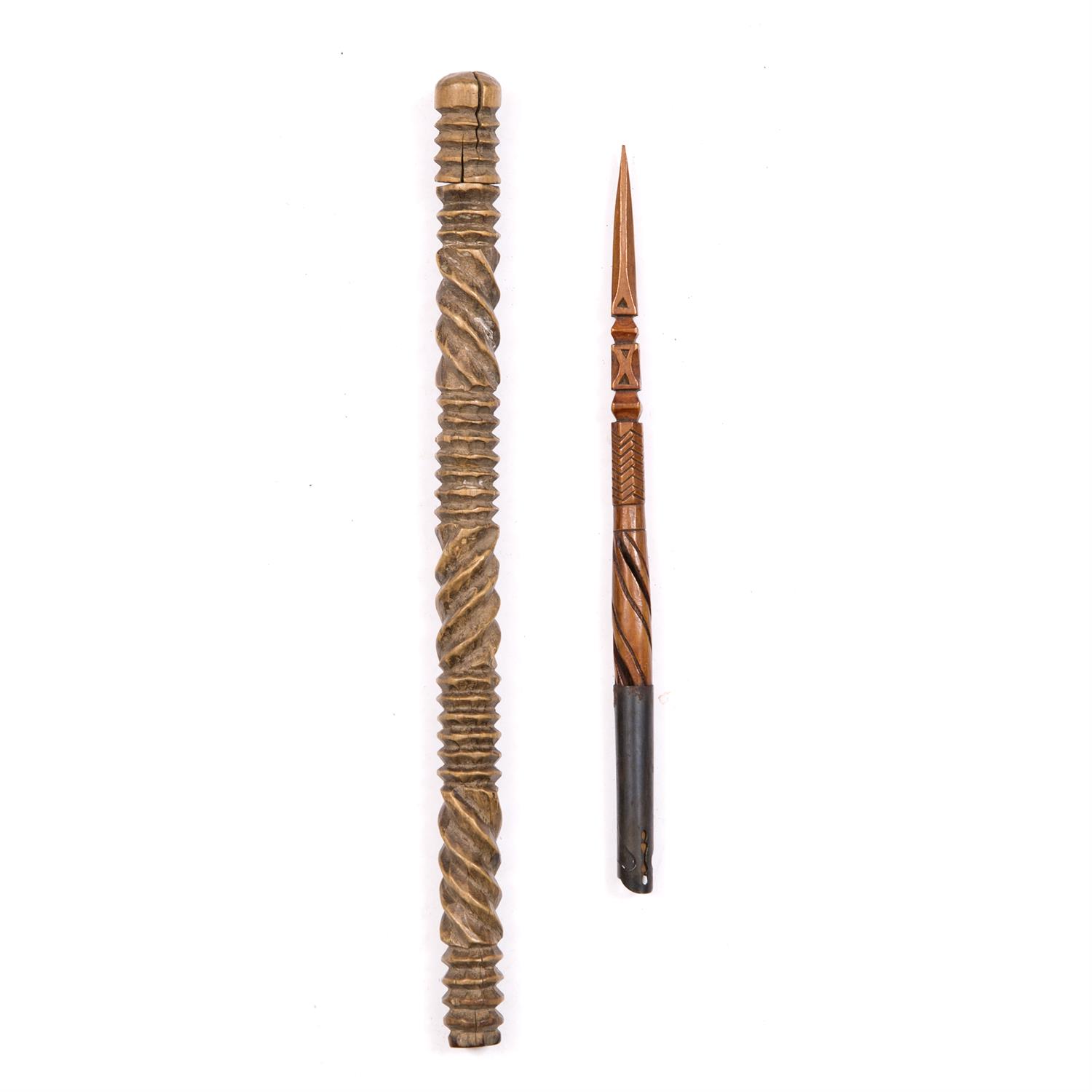 Lot 316 - A XHOSA WOODEN PIPE CLEANER with carved ribbed and ropetwist decoration