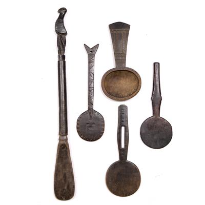 Lot 330 - THREE LOZI WOODEN COOKING LADLES for cassava cakes with scratch carved decoration; one further