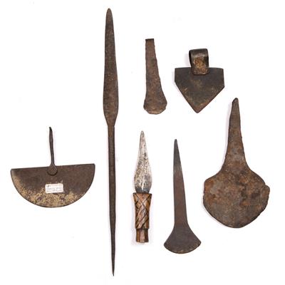 Lot 334 - AN OLD TSONGAN AXE HEAD; a Batonga knife; four metal axe heads; and a spear (7)