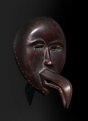 Lot 341 - A WEST AFRICAN WOODEN DAN MASK
