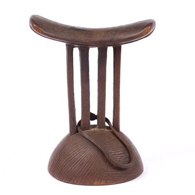 Lot 342 - A BAKUBA CONGO WOODEN HEADREST of four pillared form with scratch carved decoration