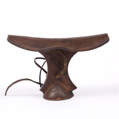 Lot 345A - A TURKANA HEADREST of plain and curved form