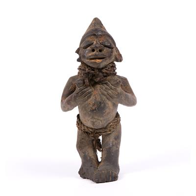 Lot 364 - A YORUBA SHANGO CLAY FIGURE in the form of a man with sennit girdle and neck decoration