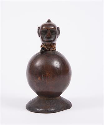 Lot 366 - AN AFRICAN FIGURE of pot-bellied form