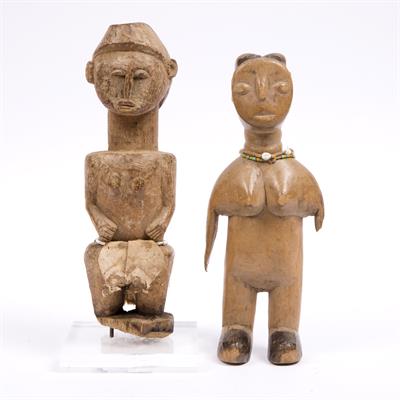 Lot 373 - AN OLD AFRICAN WOOD FIGURE carved in the form of a man with beaded girdle and cotton loin cloth