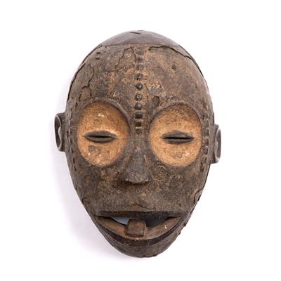 Lot 396 - A BENIN WOODEN MASK with old cracking pigments