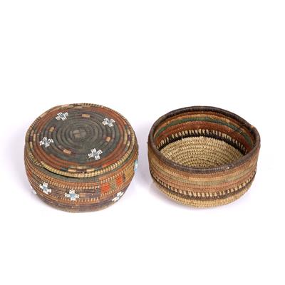 Lot 399 - AN AFRICAN BEADED BASKET AND COVER