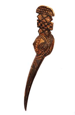Lot 432 - AN OLD NIGERIAN CARVED WOODEN BIRD MASK with a elongated beak and stylised geometric decoration &