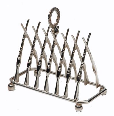 Lot 466 - A SILVER PLATED SIX DIVISIONAL TOAST RACK in the form of crossed rifles with laurel wreath handle