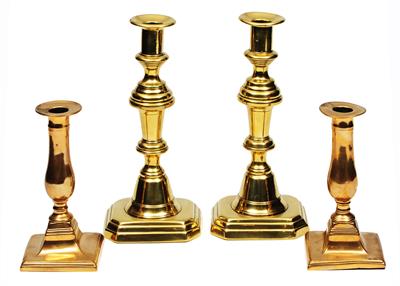 Lot 473 - A PAIR OF VICTORIAN BRASS CANDLESTICKS with double knop stems on stepped bases