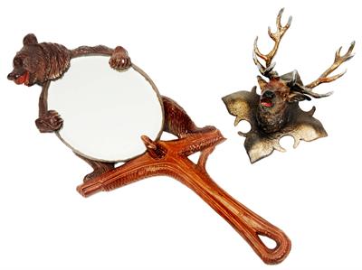 Lot 479 - A BLACK FOREST HAND MIRROR in the form of a bear on a tree stump