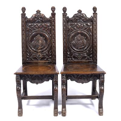 Lot 66 - Pair of carved oak hall chairs